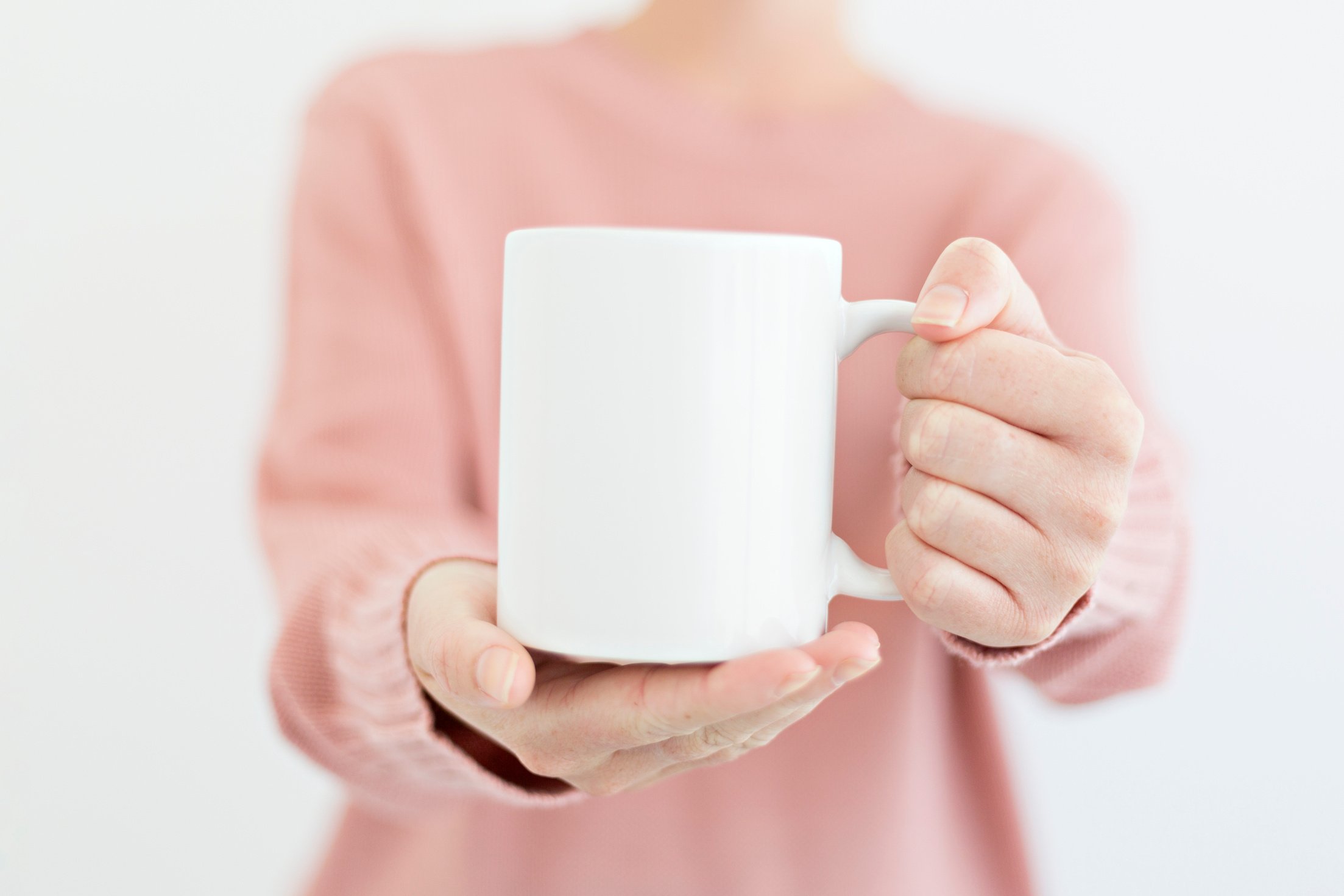 Person Holding a Coffee Mug 